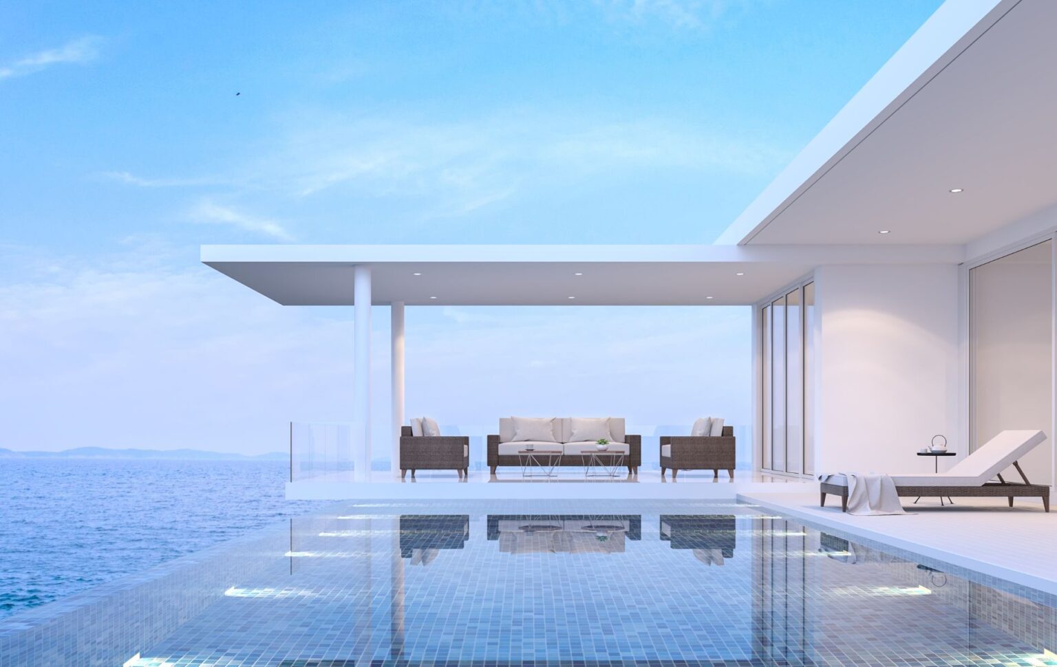 Zona exterior y piscina minimalista de un chalet de obra nueva edificado en la provincia de Valencia.